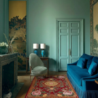 a chinoiserie inspired room with green wall and blue couch and Crimson Palace Garden Hand Tufted Viscose Rug