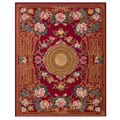 Decorative rug with floral patterns and a central emblem on a red background