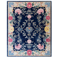 Decorative floral rug with intricate patterns on a blue background