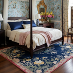 Decorative bedroom with floral wallpaper, four-poster bed, and ornate mirror.
