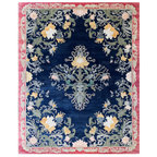 Decorative rug with floral and paisley pattern on a blue background