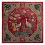 Decorative rug with crane design on a red background