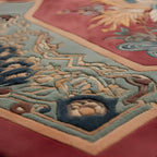 Close-up of an intricately designed rug with colorful patterns